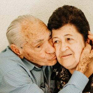 a man and a woman smiling